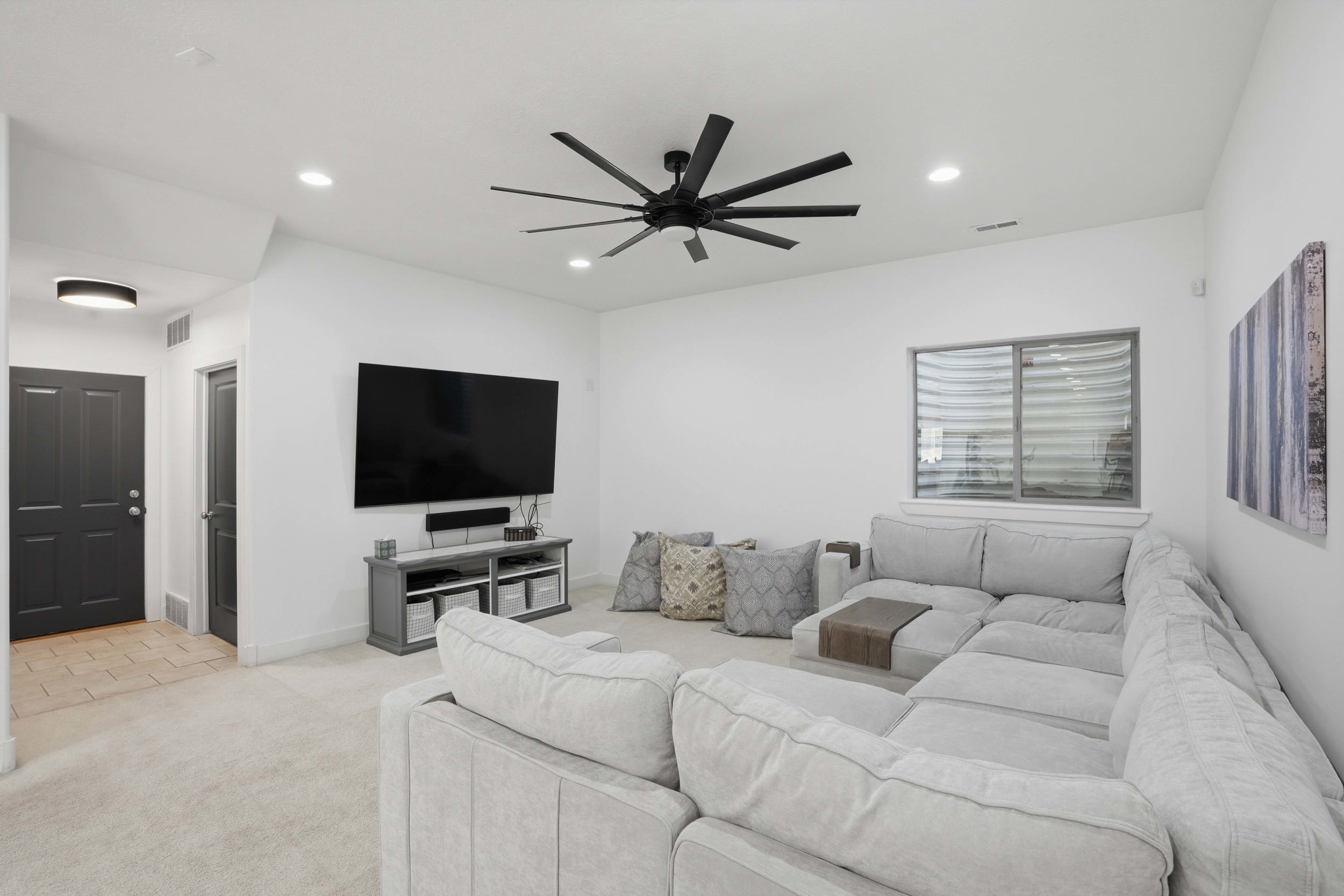 Tall ceilings & lots of storage space. Doors lead to utility room and oversized garage