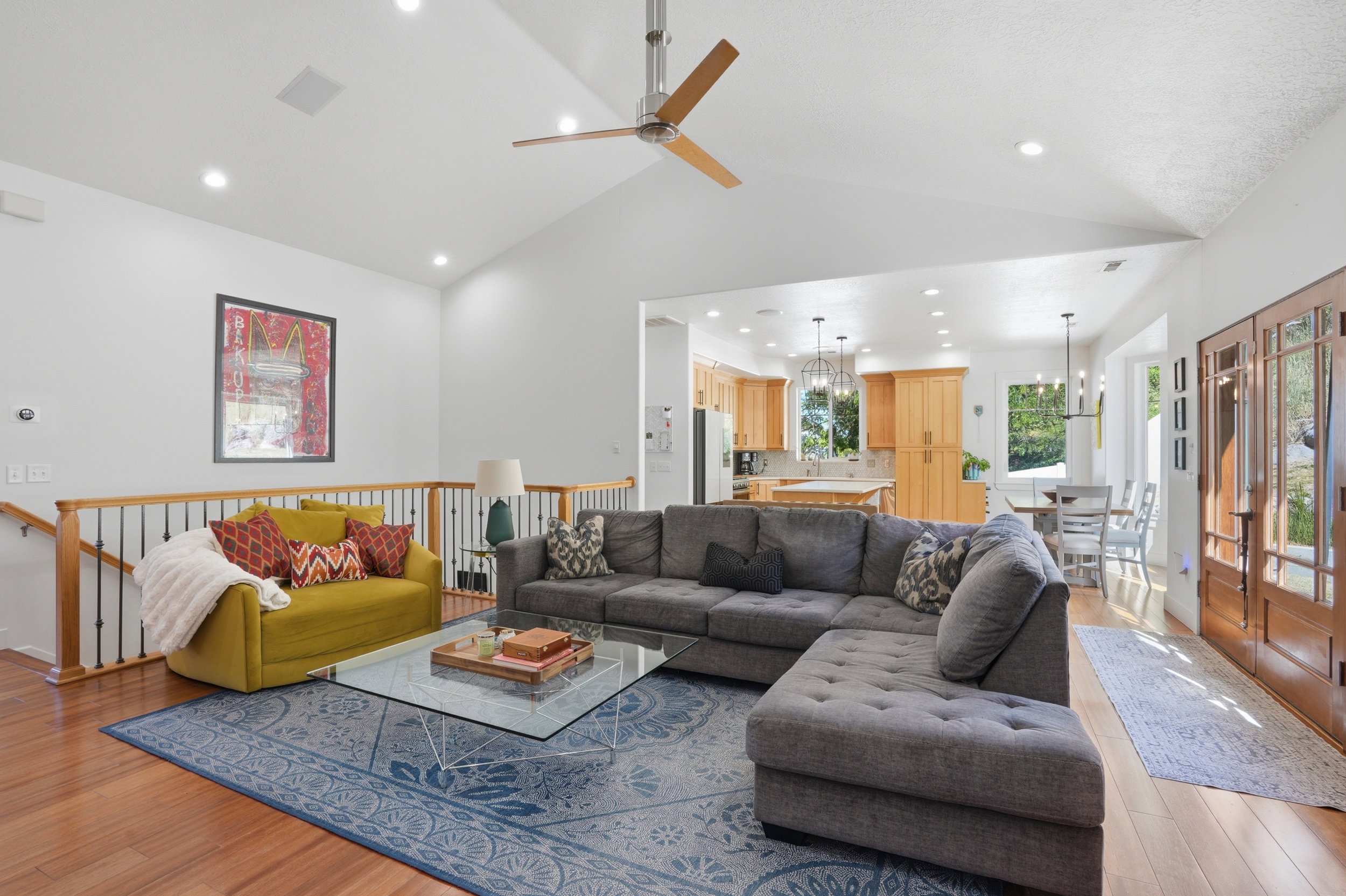 Natural light floods into the living area, kitchen and dining spaces with beautiful views of nature