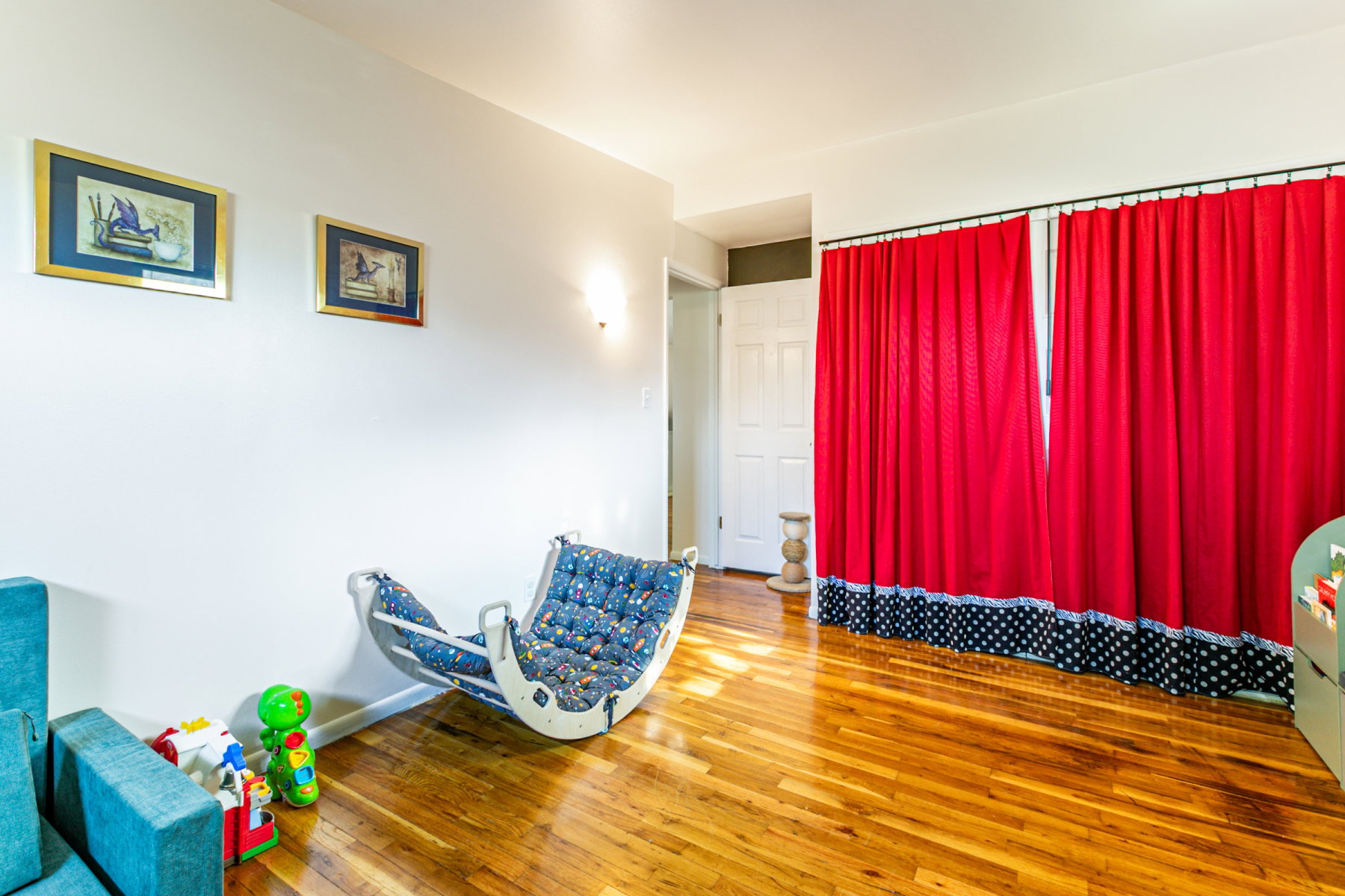 Hardwood-finish flooring throughout, complemented by a white painted wall and ceiling and a large closet.