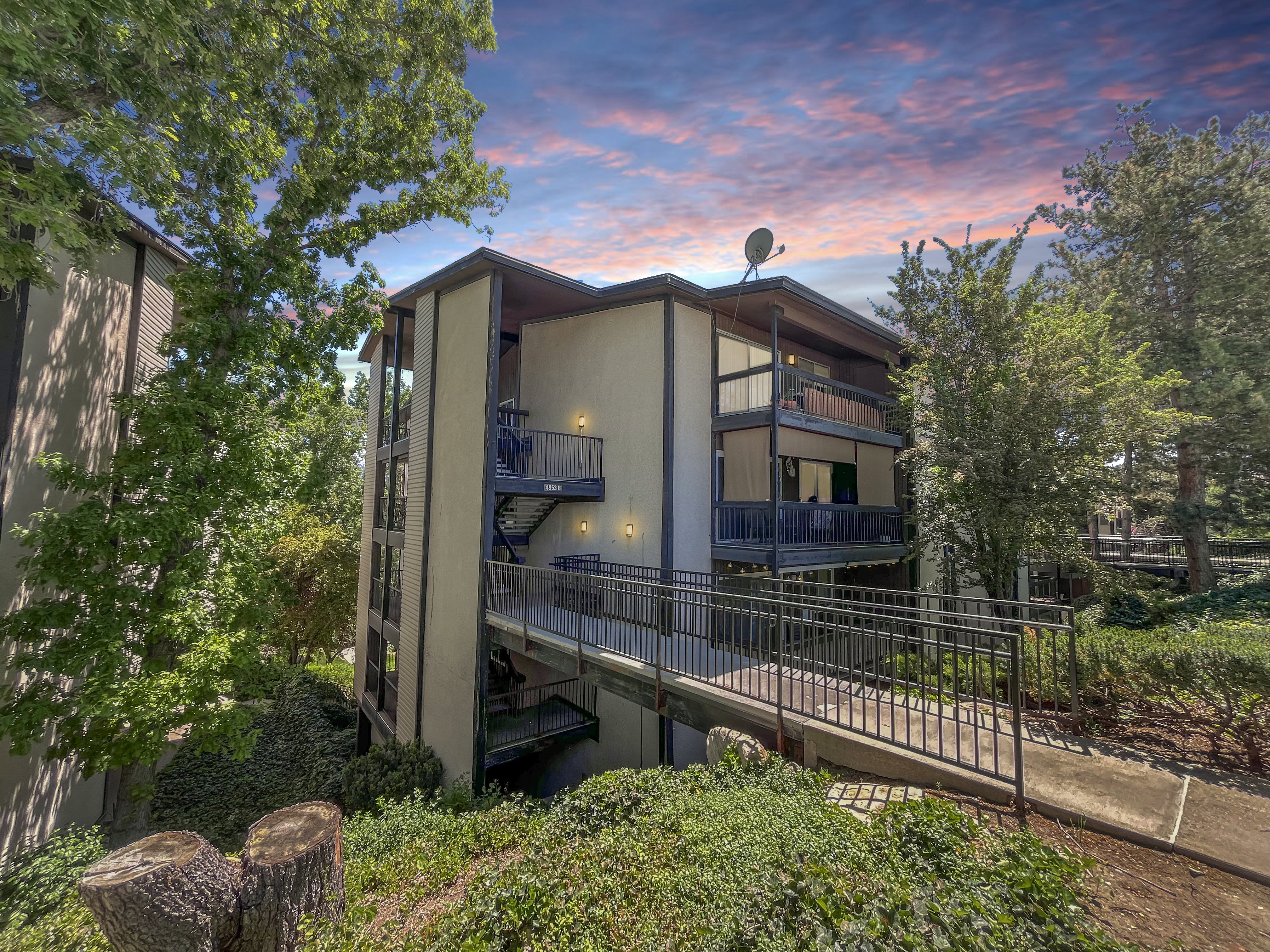Classy view of the exterior and mature landscape.