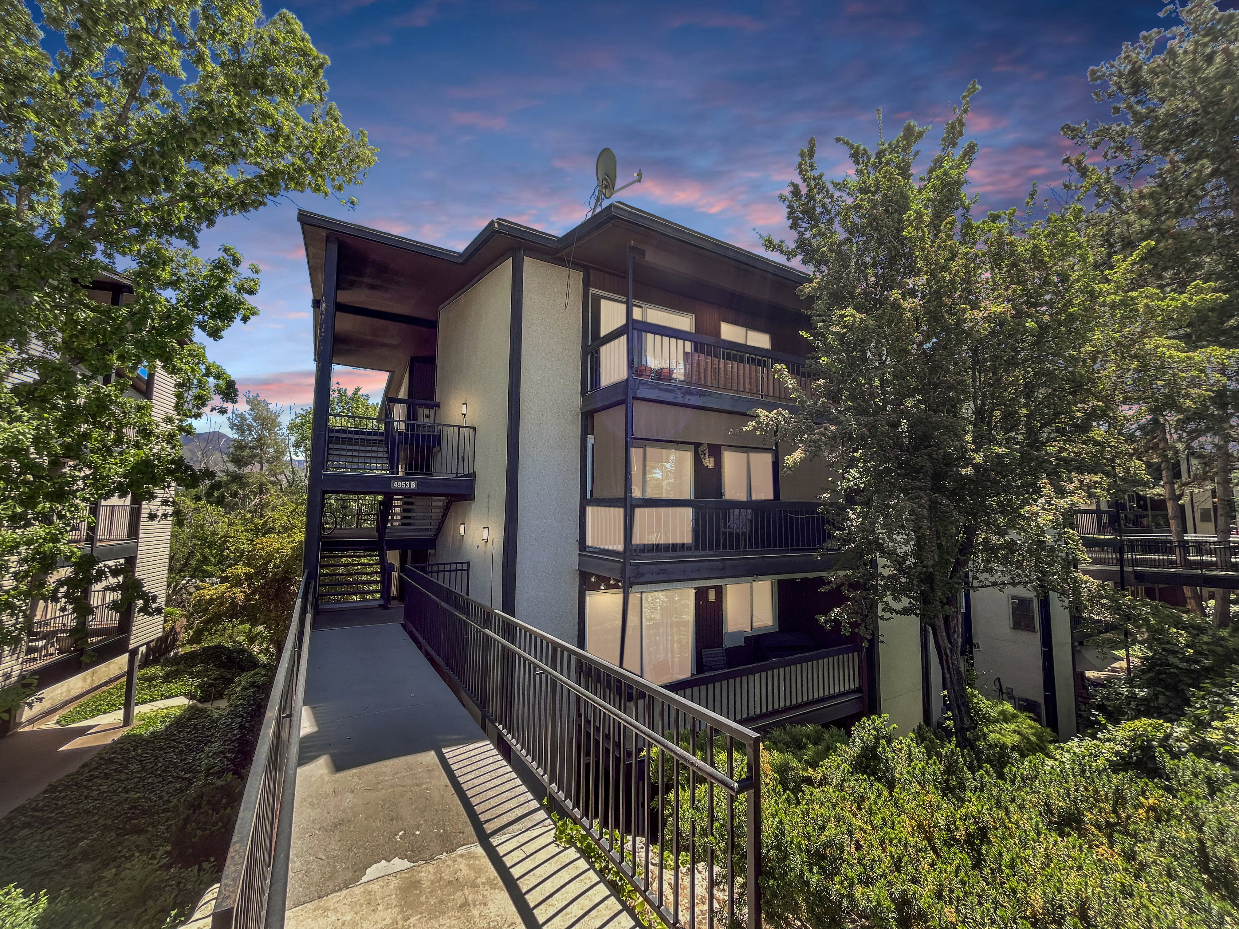 Classy view of the exterior and mature landscape.