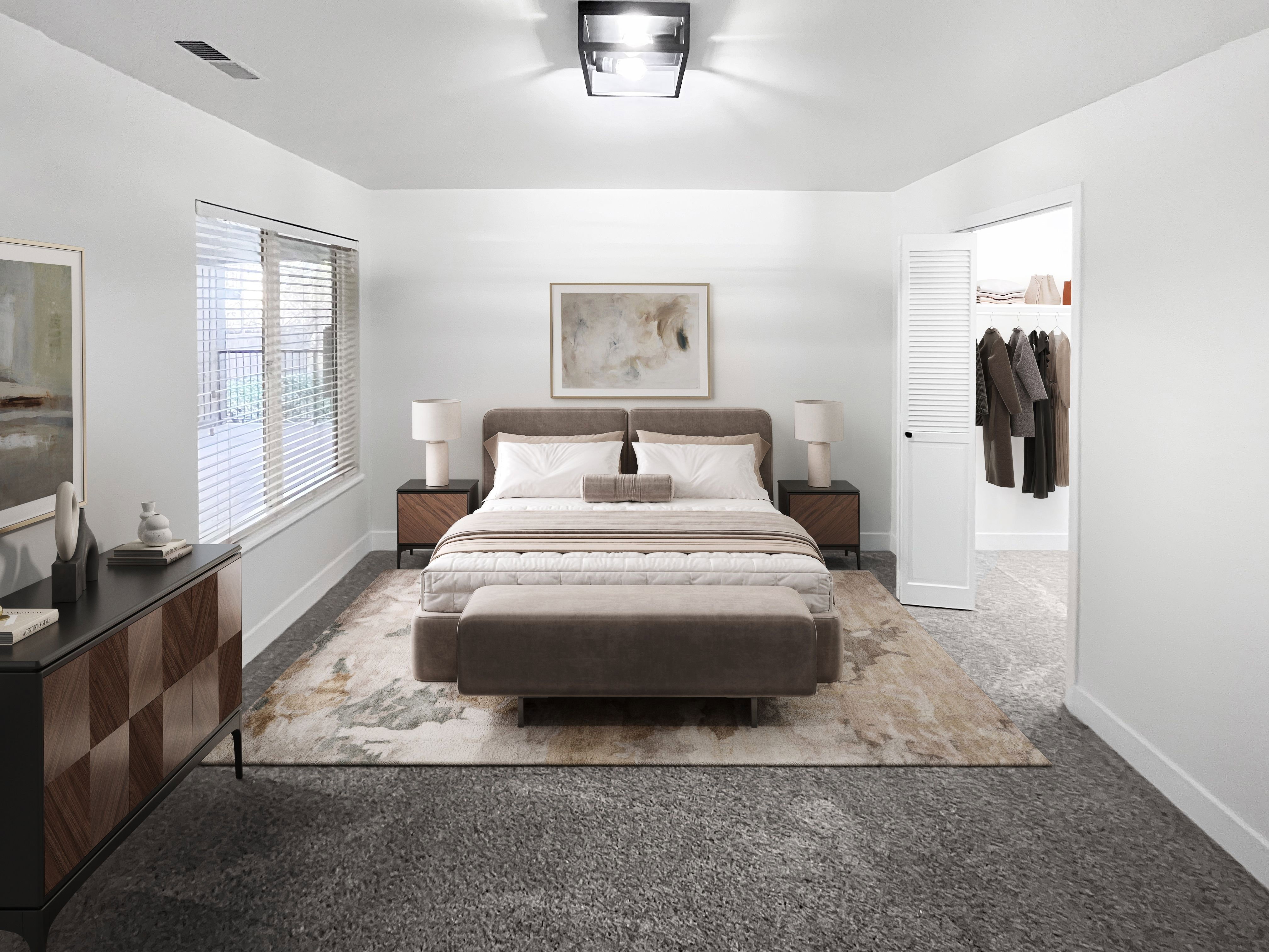VIRTUALLY STAGED-Second Bedroom featuring tall baseboards, cozy plush carpet, warm tones, and convenient bathroom access through a walk-in closet