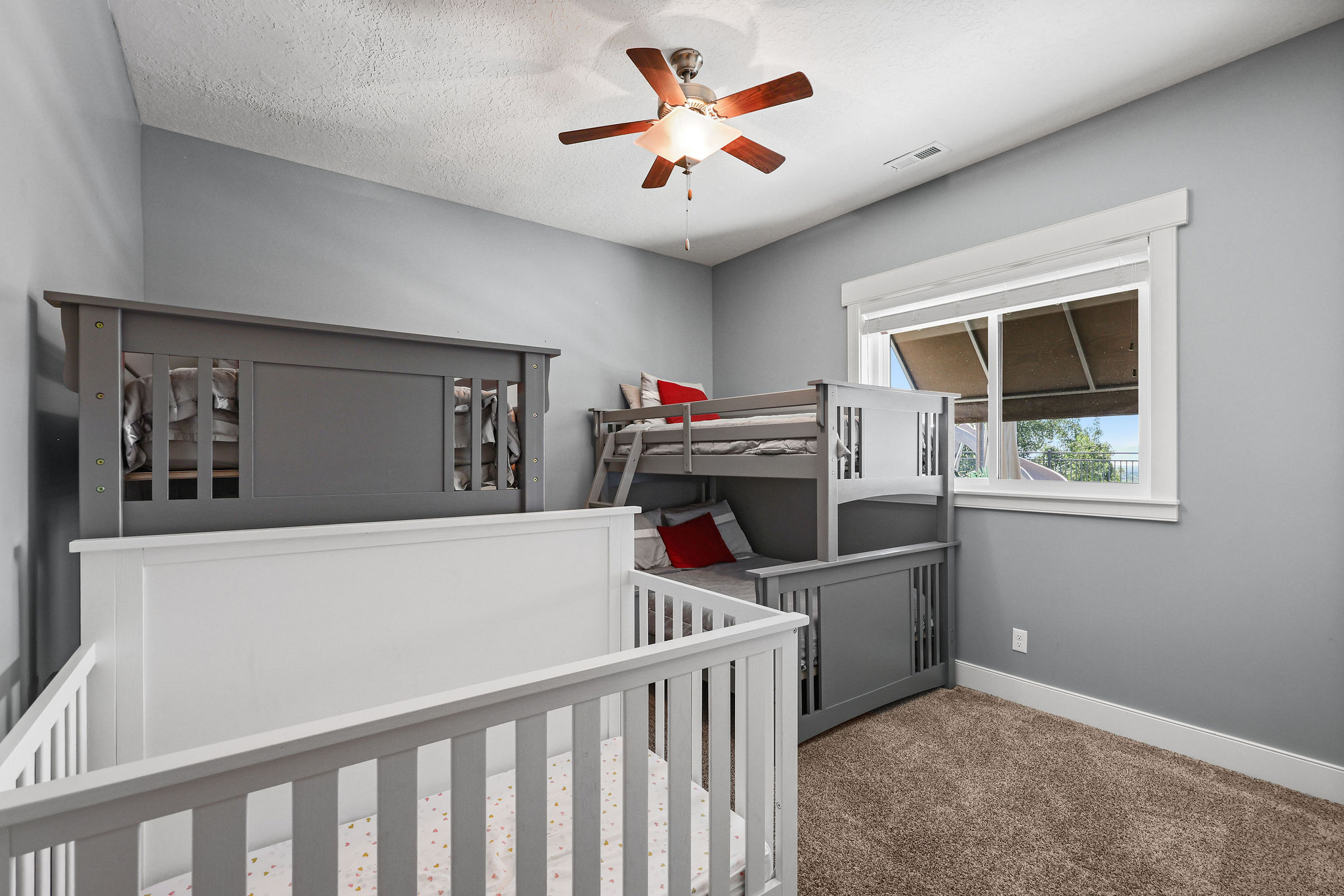 Room featuring light gray painted walls and brown carpet flooring
