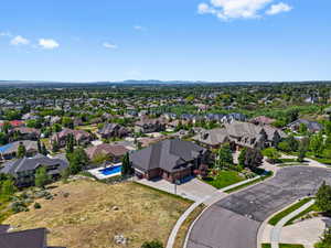 Expansive property with a dark-pitched roof and brick exterior