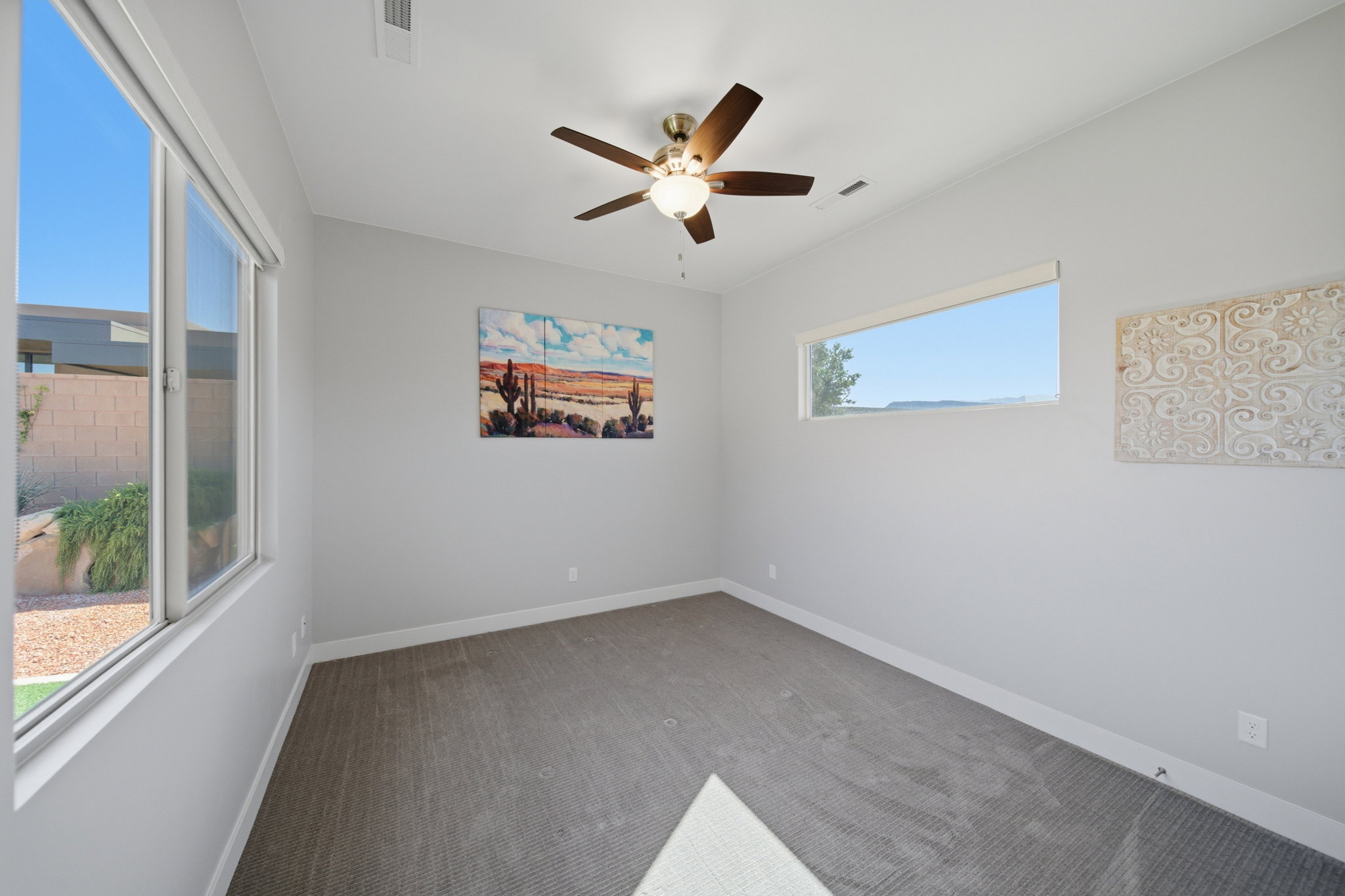 Neutral tone wall color with textured carpet flooring