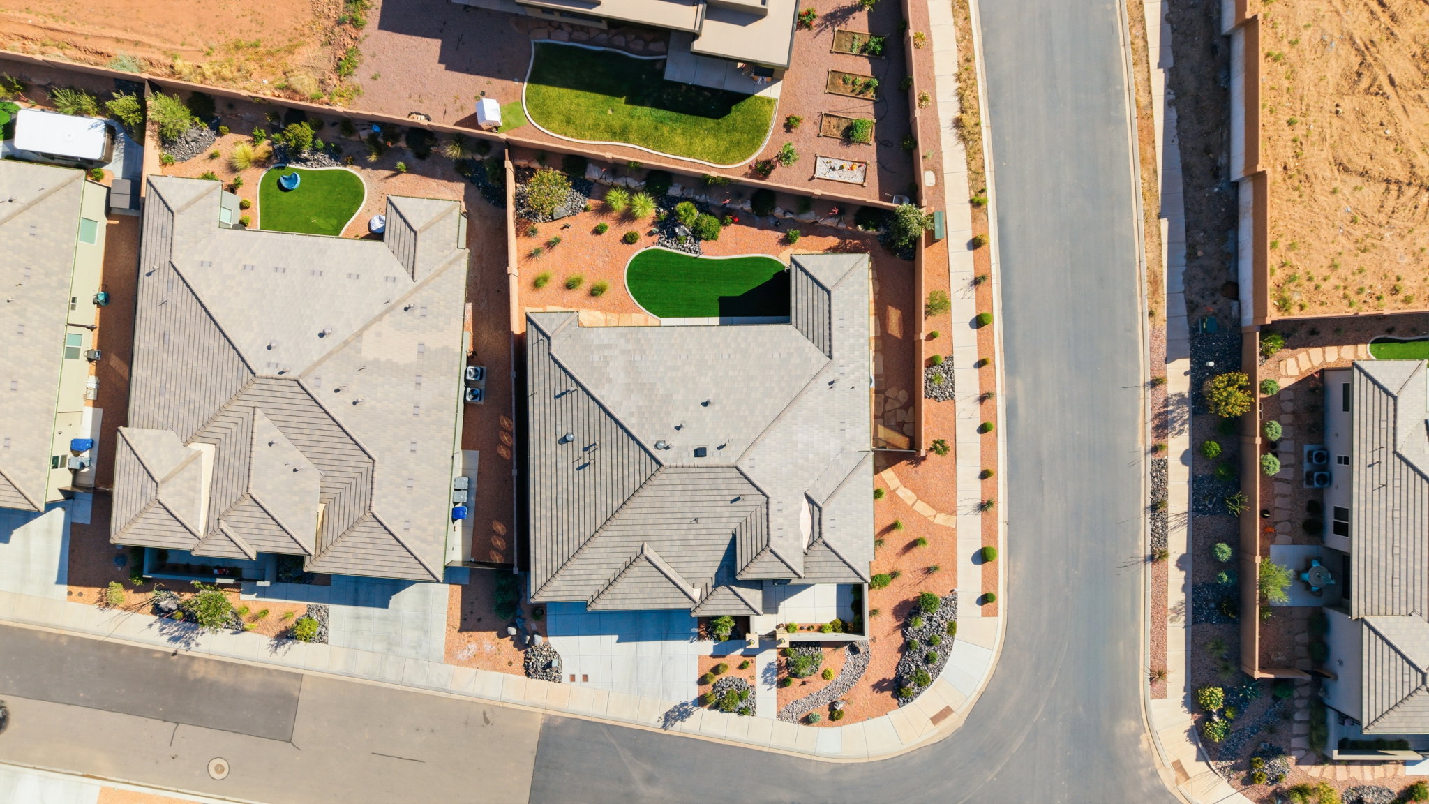 Aerial perspective highlighting a residential property with a multi-gabled roofline