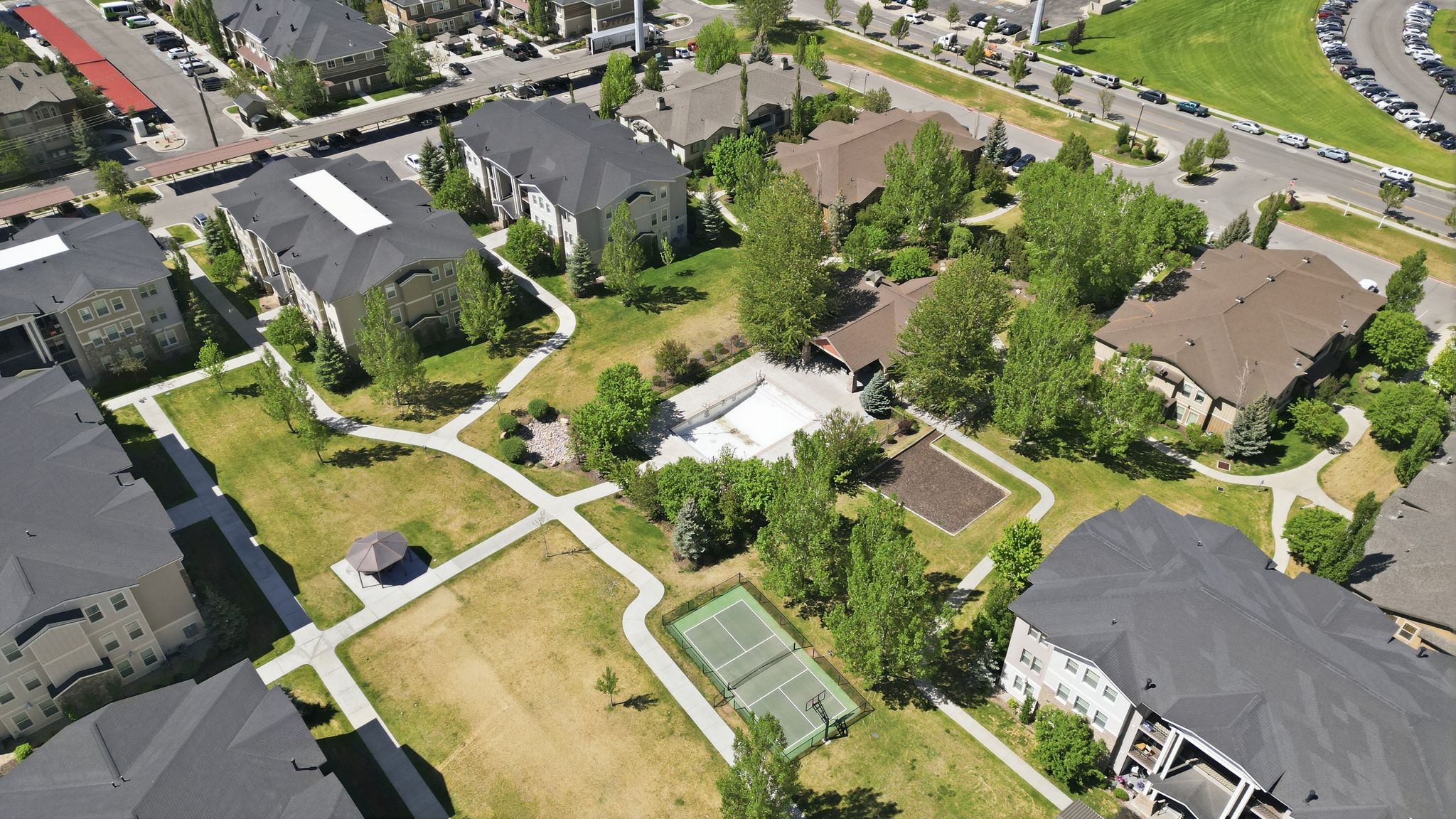 Aerial perspective highlighting multiple residential buildings and communal amenities