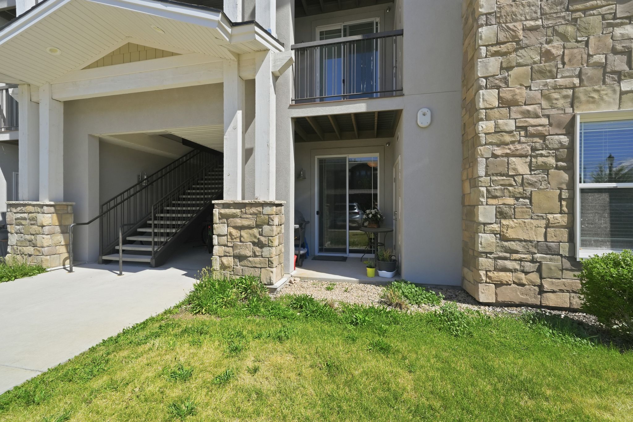 Exterior featuring stone veneer and stucco siding