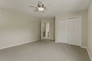 Neutral-toned carpeting paired with light wall paint