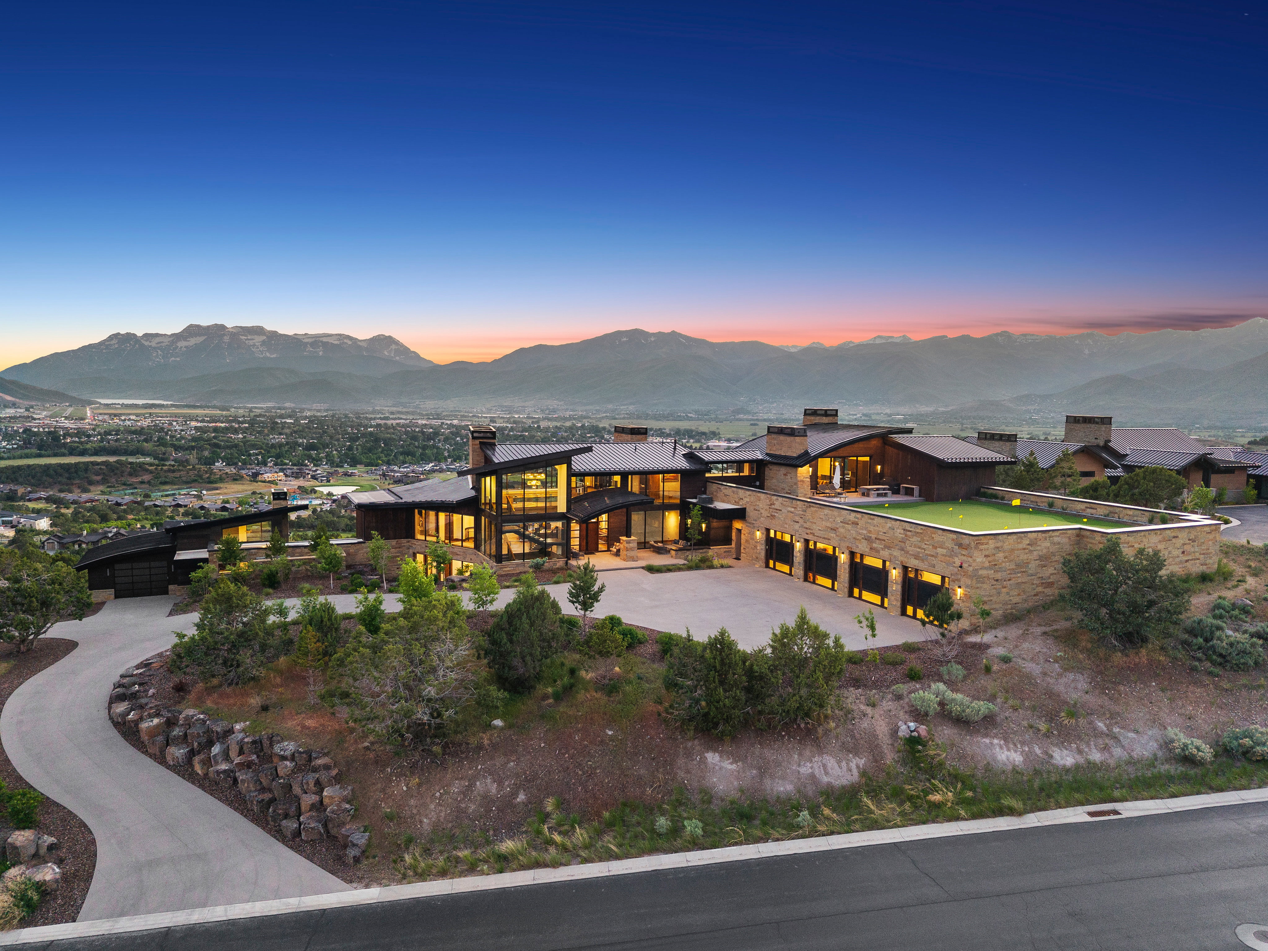 Expansive modern estate with mountain backdrop