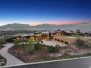 Expansive modern estate with mountain backdrop
