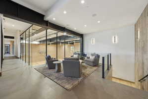 Interior recreation space featuring a full-sized court behind glass walls