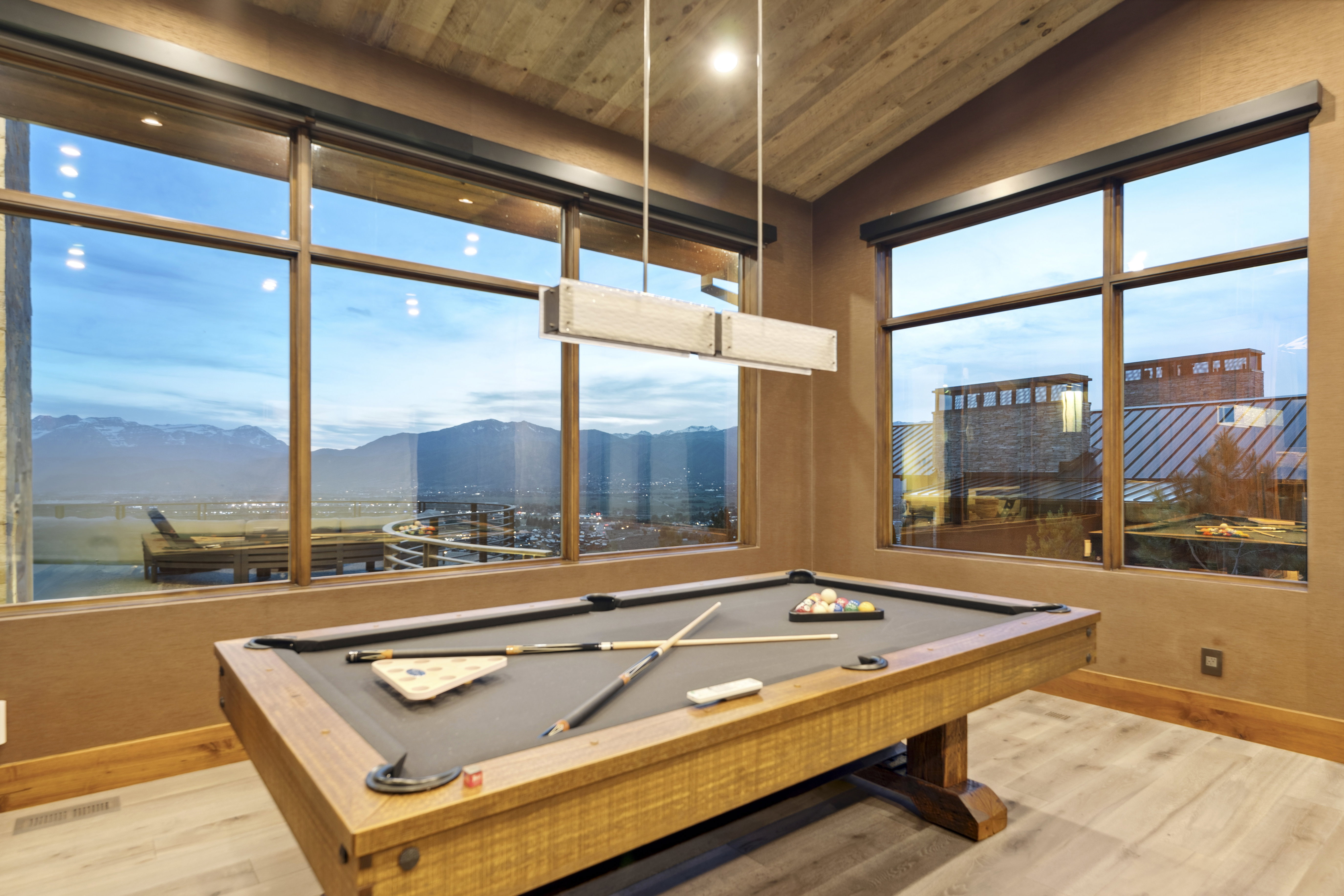 Reclaimed wood-finish vaulted ceiling with recessed lighting