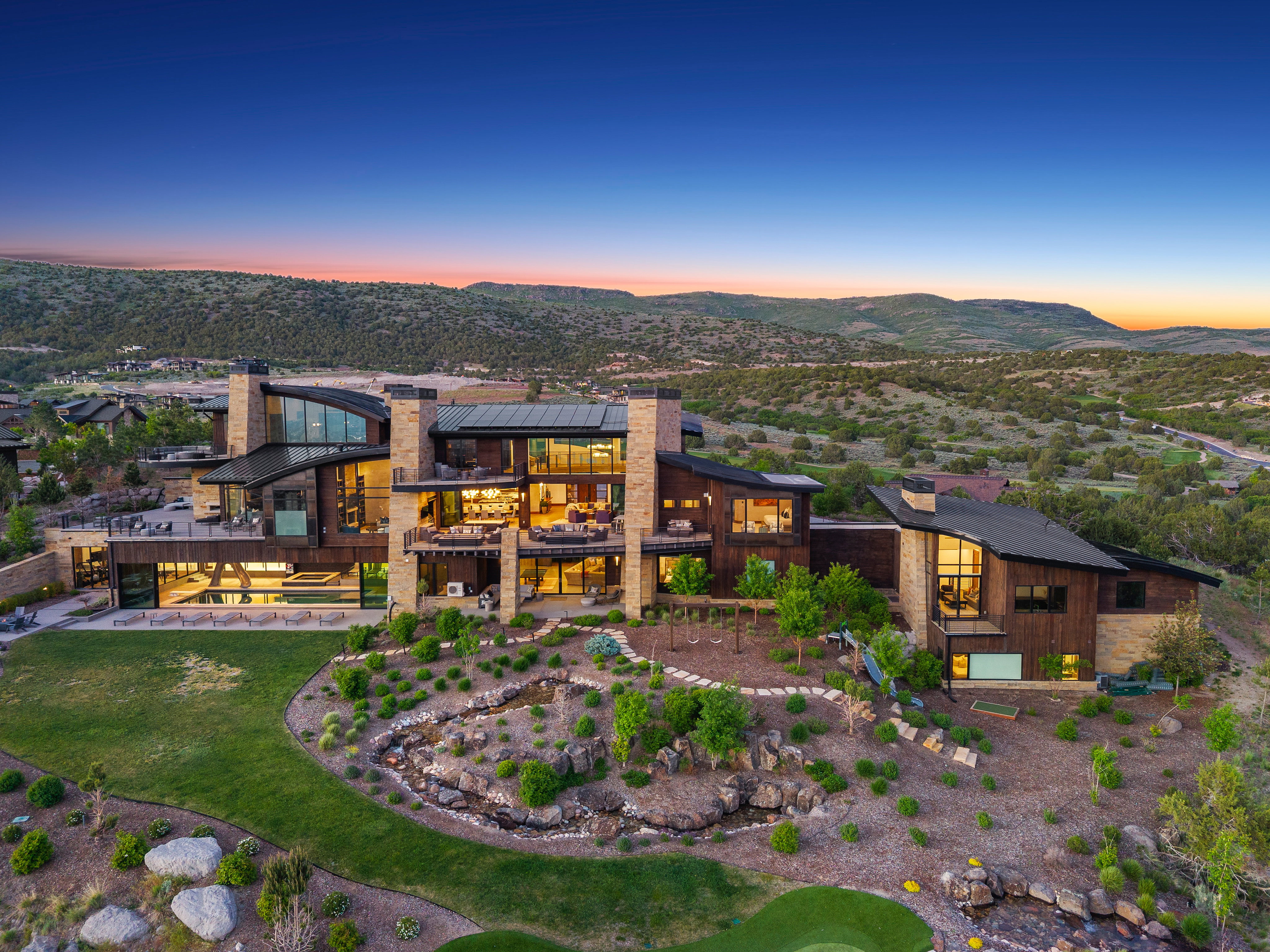 Contemporary residence featuring a multi-level design with extensive outdoor decking