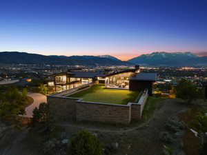 Contemporary architectural design featuring extensive glazing and a stone-clad exterior