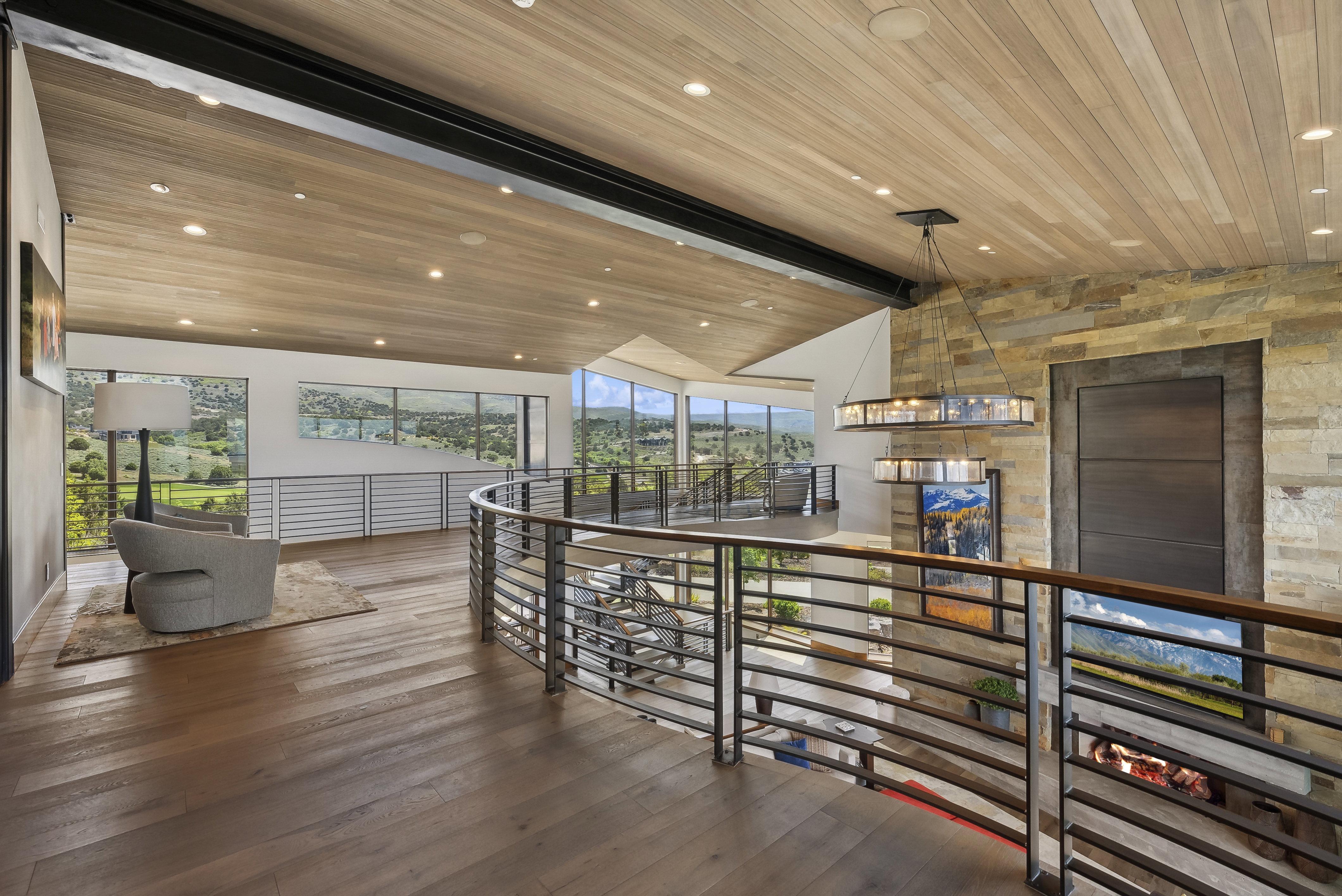 Expansive wood-finish flooring throughout