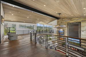 Expansive wood-finish flooring throughout