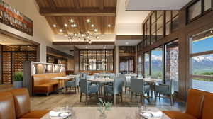 Spacious dining area featuring wood-finish flooring, a wood-paneled ceiling with exposed beams, and a contemporary chandelier