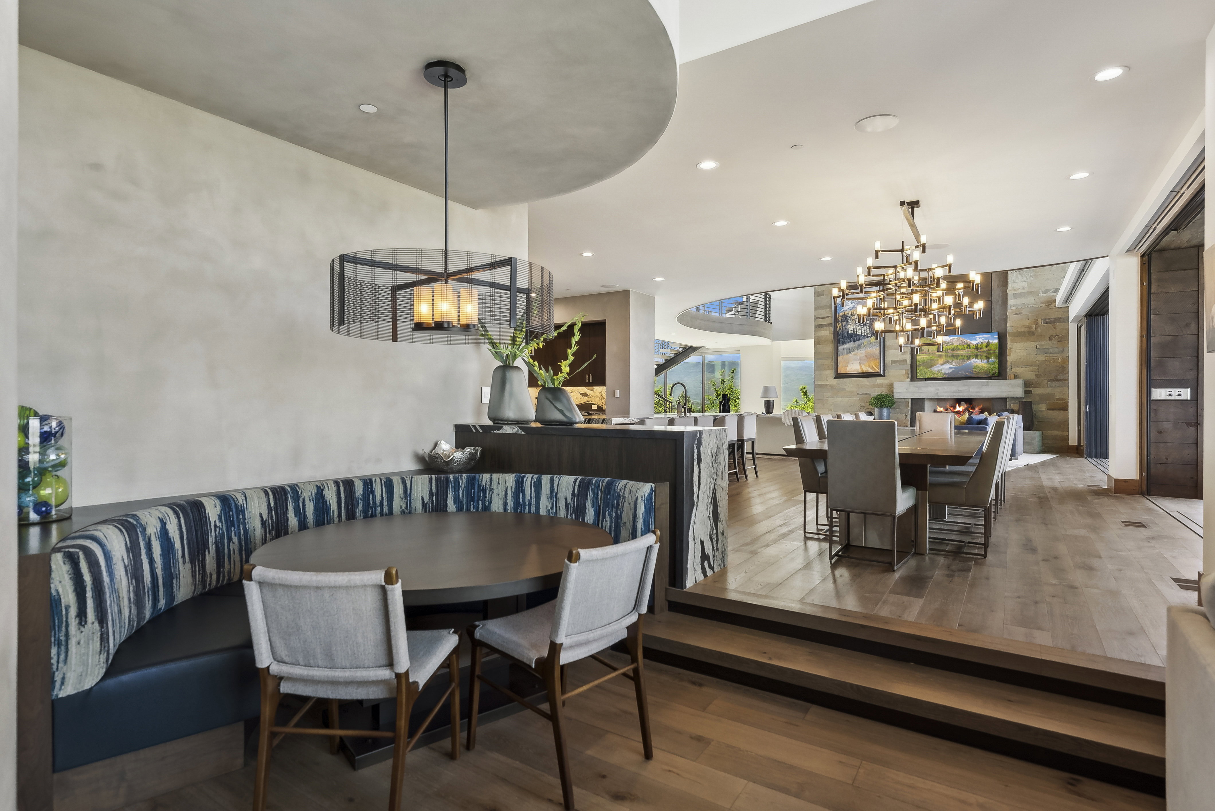 Integrated dining area featuring a custom built-in banquette with upholstered seating