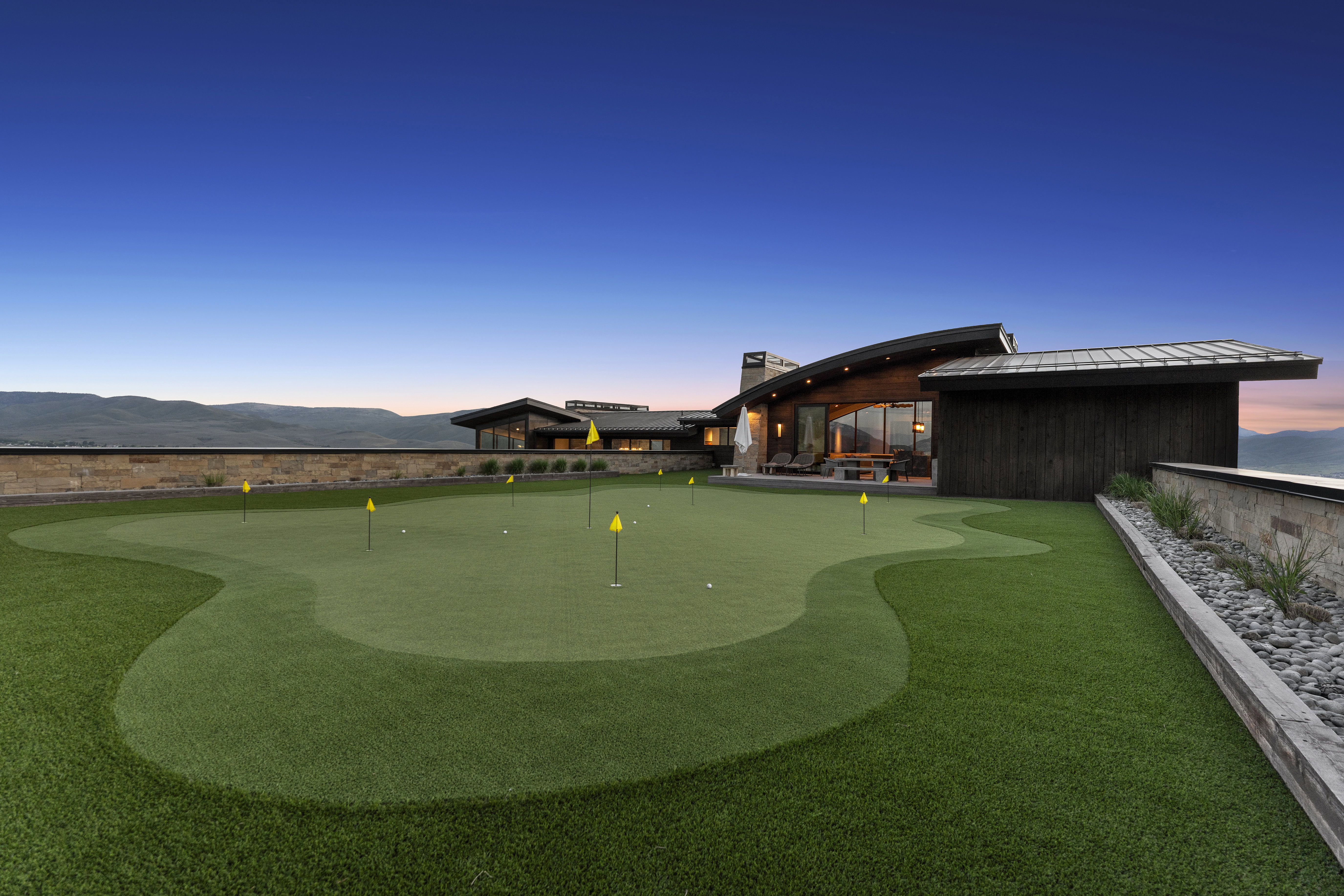 Expansive putting green featuring multiple holes