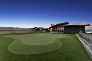 Expansive putting green featuring multiple holes