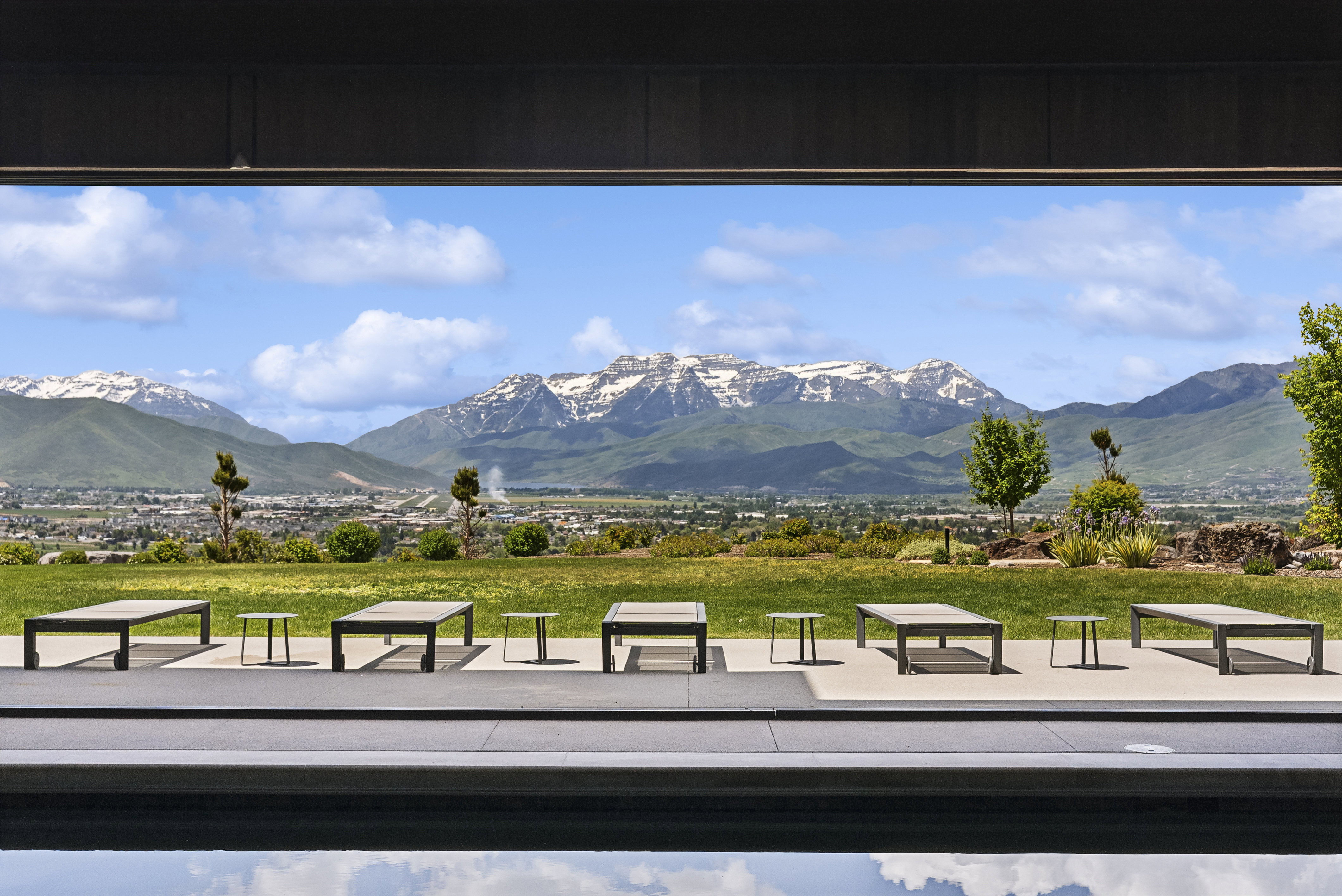 Expansive mountain scenery framing a contemporary outdoor living space