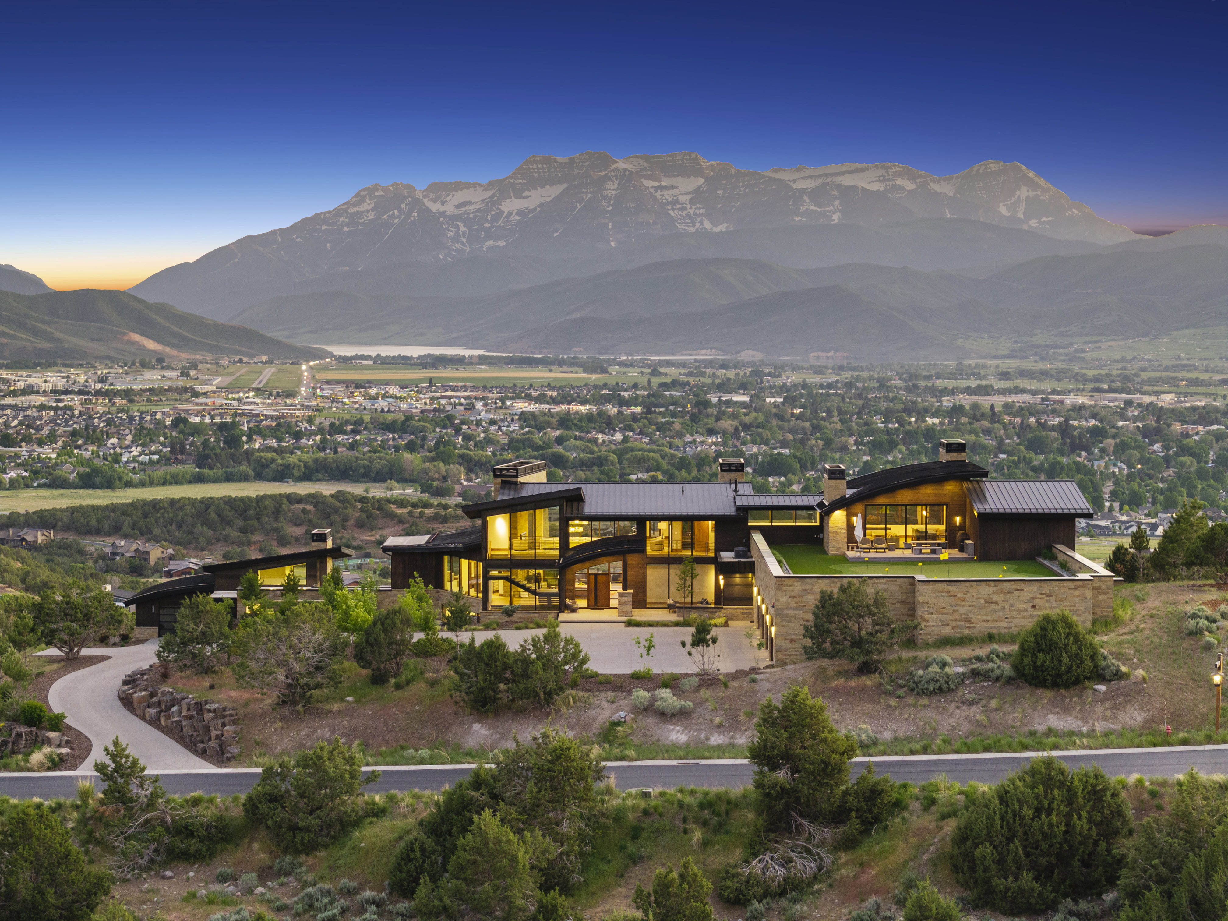 Expansive modern residence with a prominent mountain backdrop