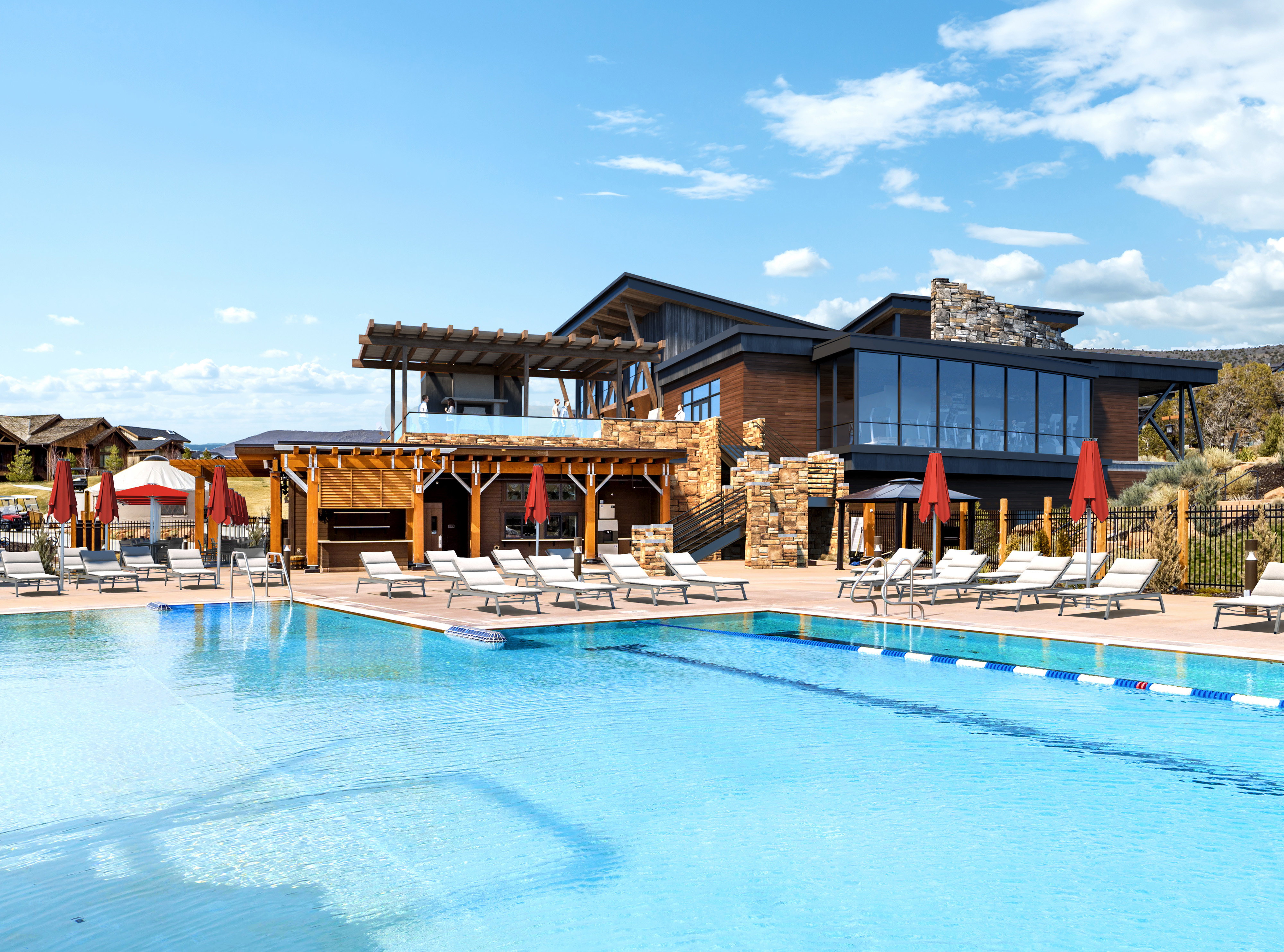 Expansive outdoor swimming pool with lap lanes and a surrounding deck featuring multiple lounge chairs
