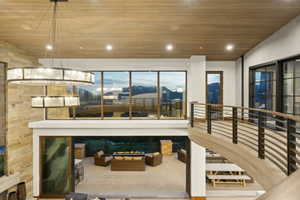 Soaring ceilings with wood-finish panels and recessed lighting