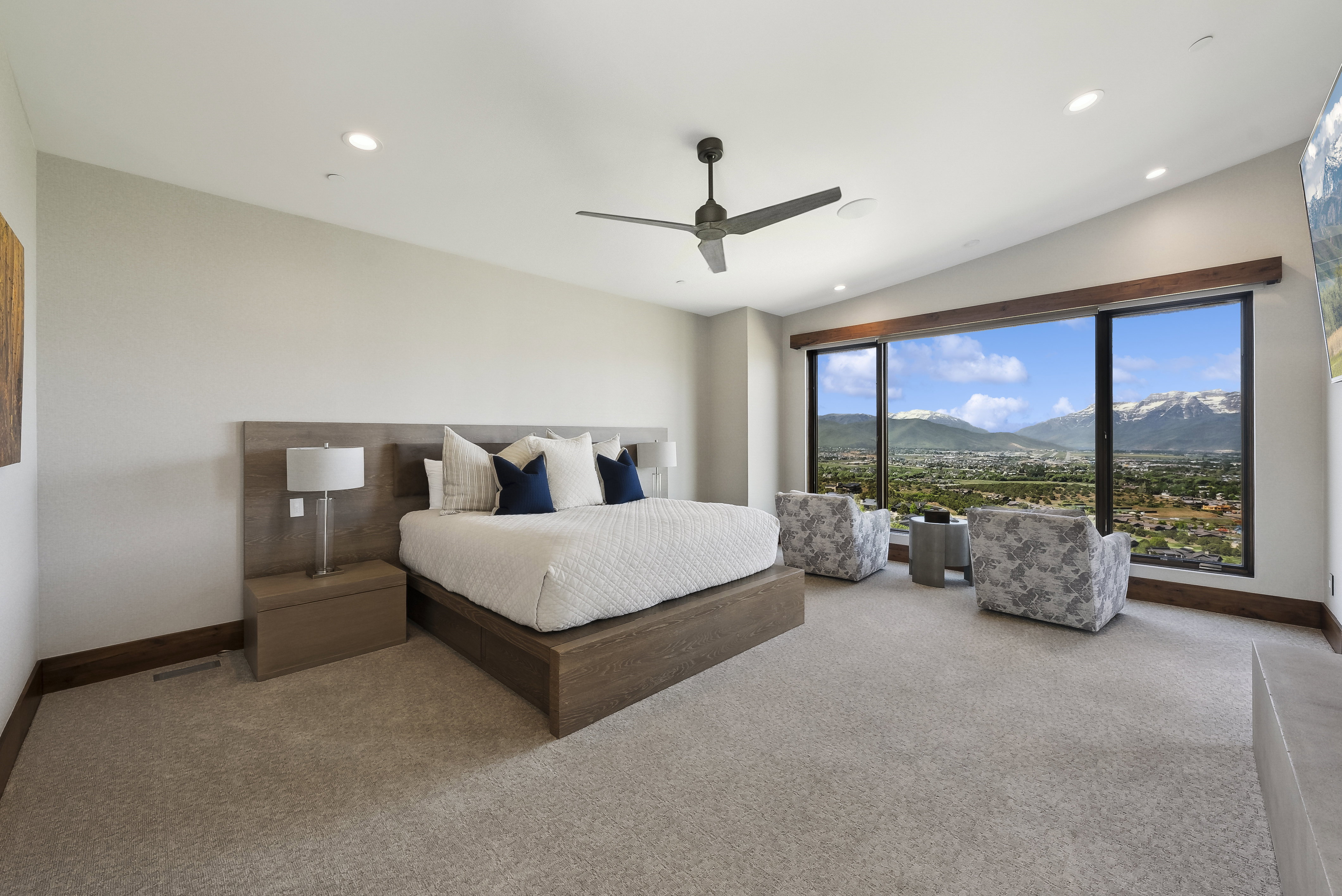 Expansive window wall with mountain and valley scenery