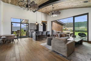 Vaulted ceiling with wood-finish planks and exposed beam