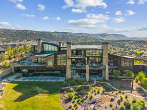 Expansive contemporary residence featuring multiple levels of outdoor living spaces