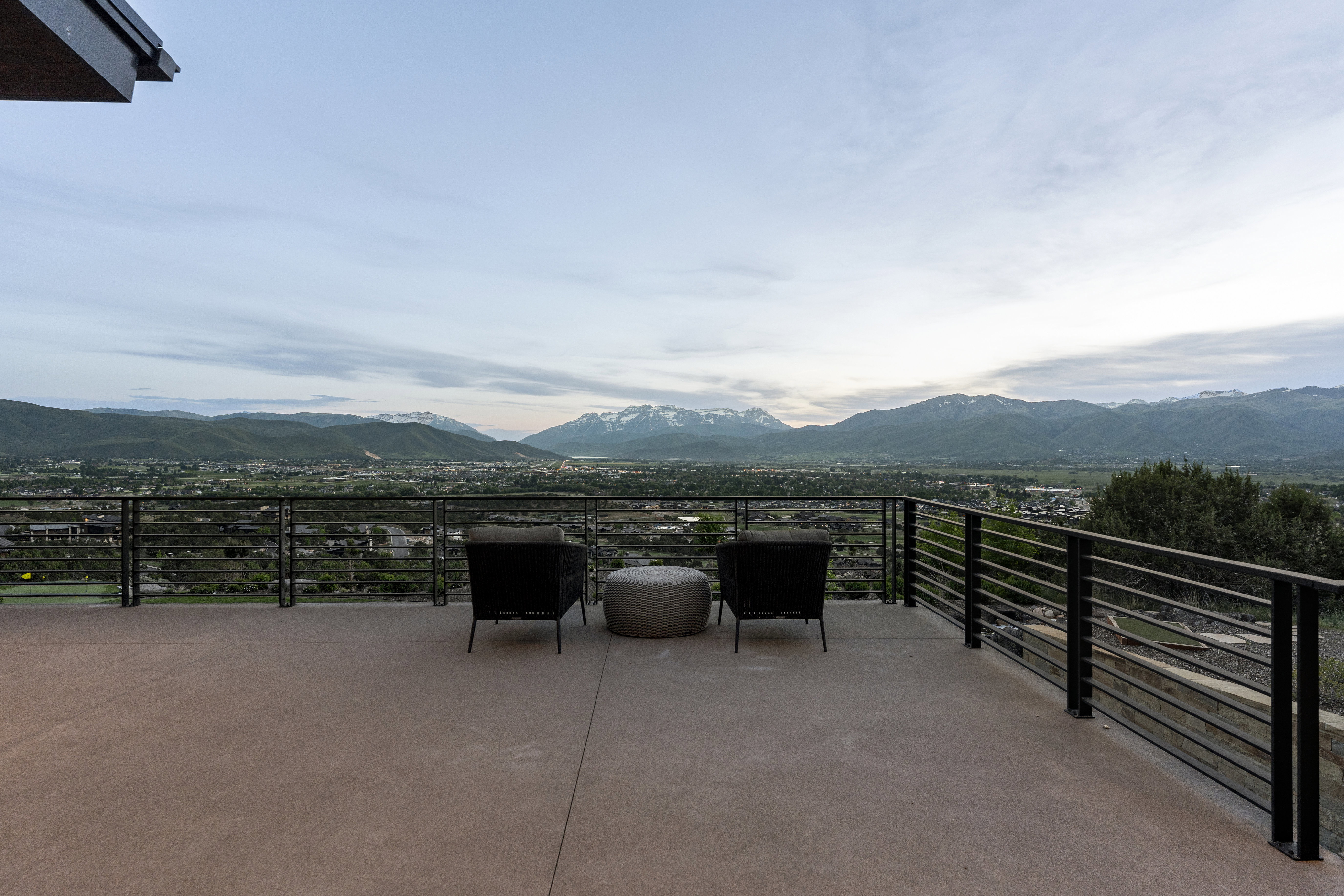 Expansive outdoor deck featuring a mountain and valley backdrop
