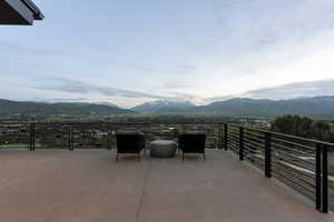 Expansive outdoor deck featuring a mountain and valley backdrop