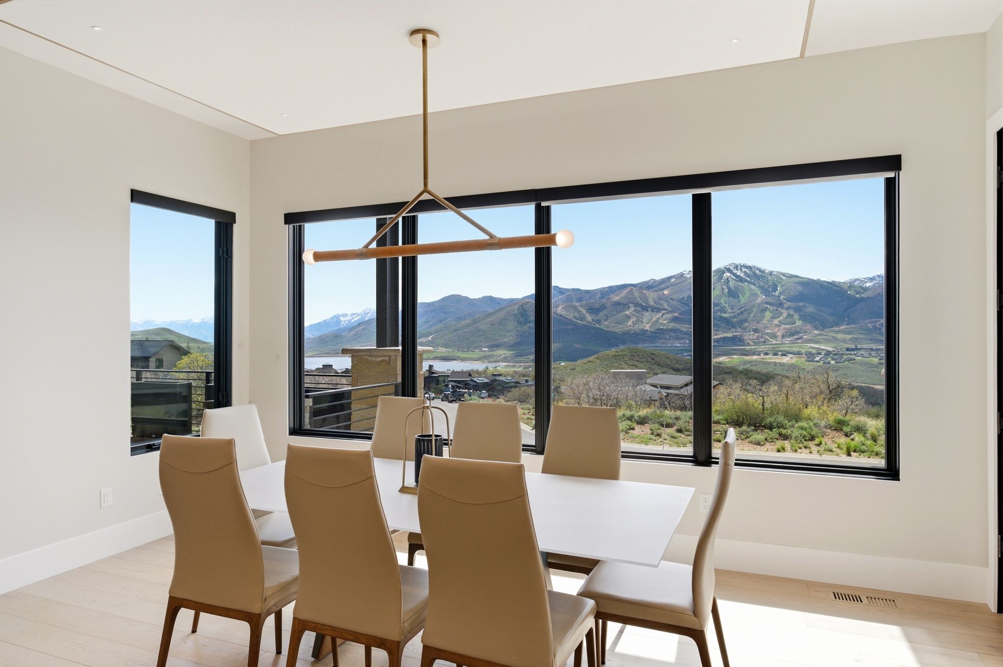Expansive windows showcasing mountain and water scenery