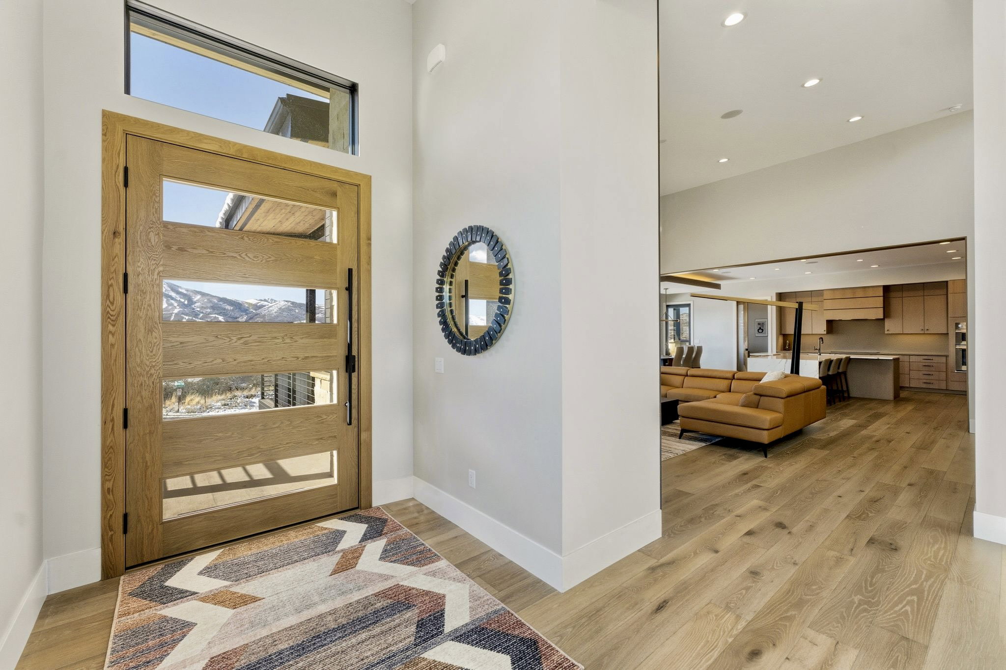 Modern entry door with integrated glass panels and transom window