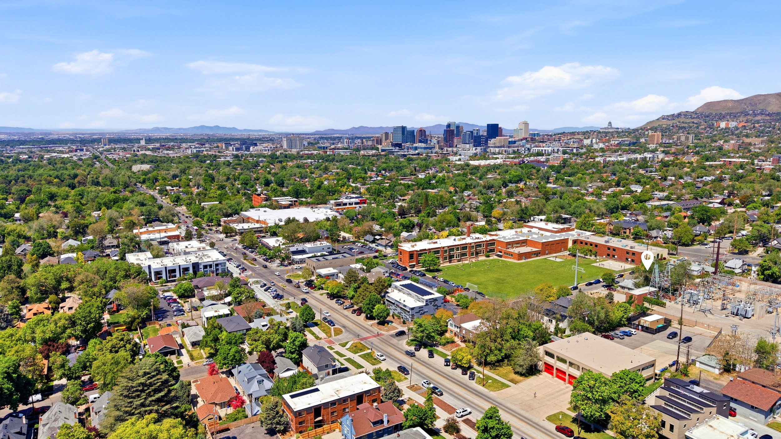 Aerial perspective showcasing a vibrant urban landscape with extensive tree canopy