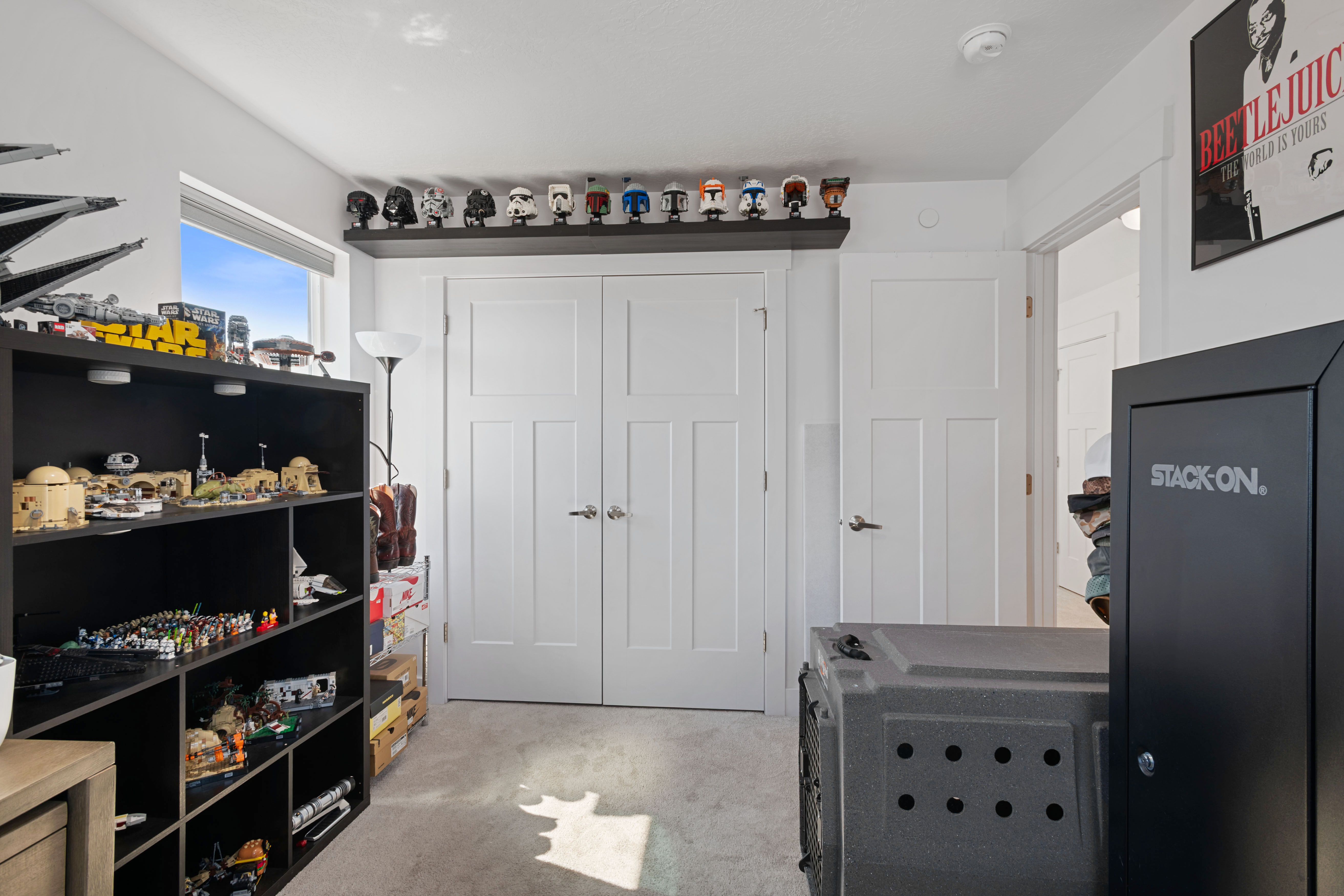 Recessed window offering natural light, plush carpeted flooring, and white paneled doors