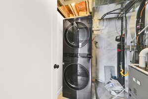 Stacked laundry appliances in a utility area