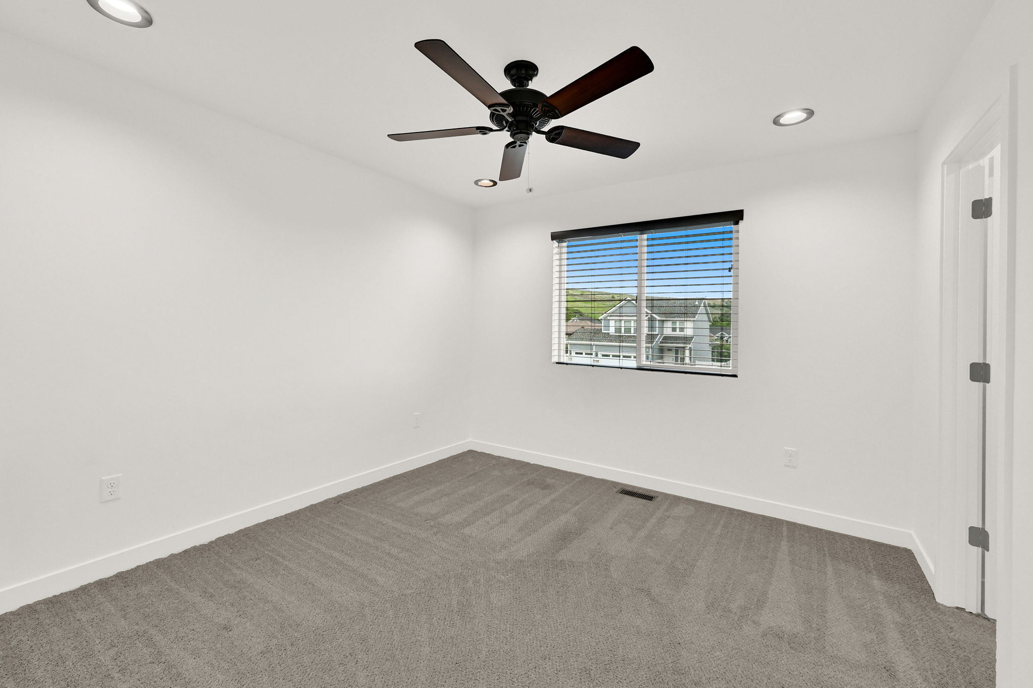 Bedroom featuring recessed lighting, a ceiling fan, a window with horizontal blinds, and neutral-toned carpeting