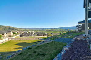 Expansive property featuring a terraced landscape and a distant mountain range