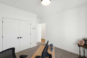 Neutral color palette room featuring a flush-mount ceiling light and white baseboards