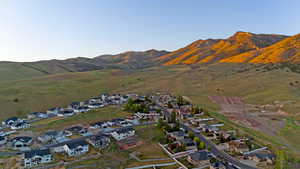 Residential community featuring a variety of home styles, paved streets, and green landscaping