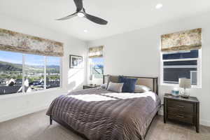 Bedroom featuring expansive windows, recessed lighting, a ceiling fan, and carpet flooring
