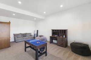 Open concept room with recessed lighting and neutral wall paint