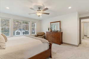 Spacious room with multiple windows, recessed lighting, and a ceiling fan