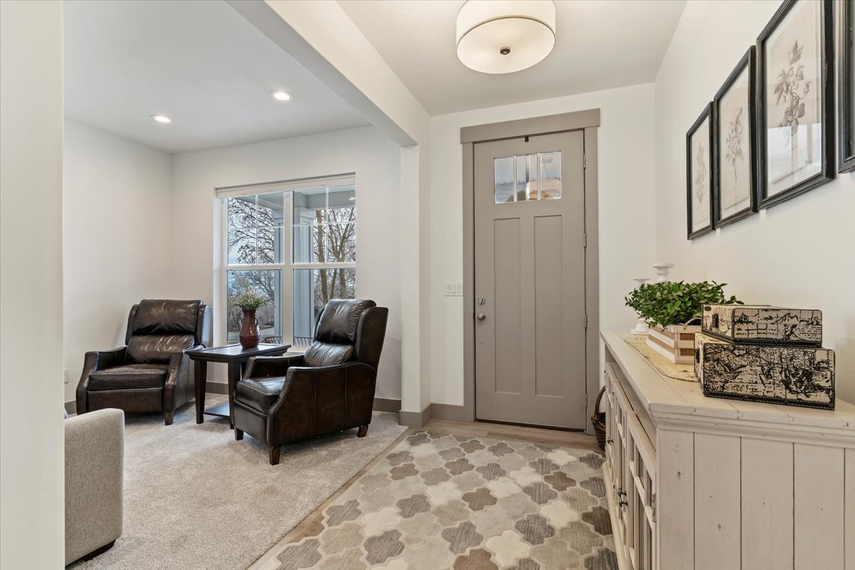 Entryway featuring a Craftsman-style door with upper window panes, recessed lighting, and a white flush-mount ceiling fixture