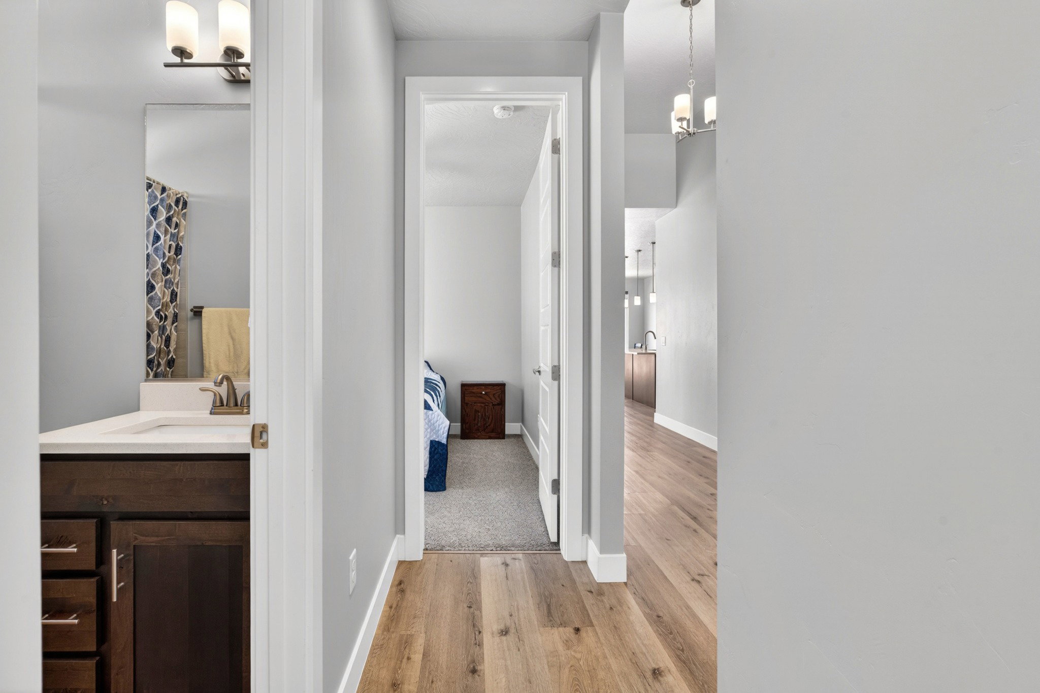 Wood-finish flooring throughout the hallway