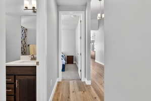 Wood-finish flooring throughout the hallway