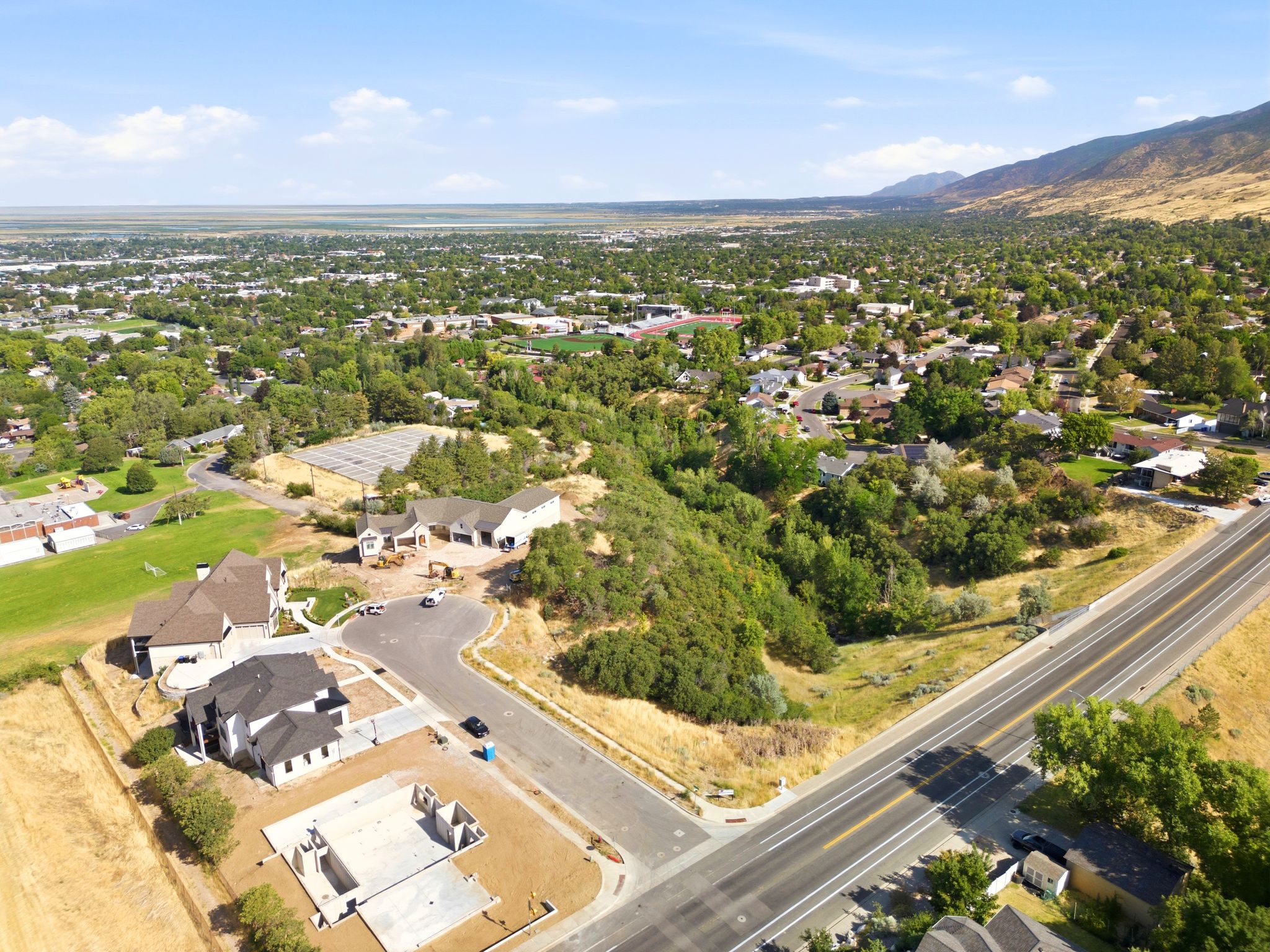 Aerial perspective highlighting a newly developed residential area with surrounding natural landscapes